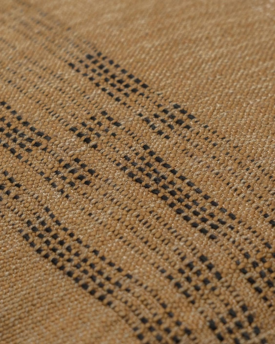 Yon Ochre cushion in ochre brown, shown in a product close-up as image 6