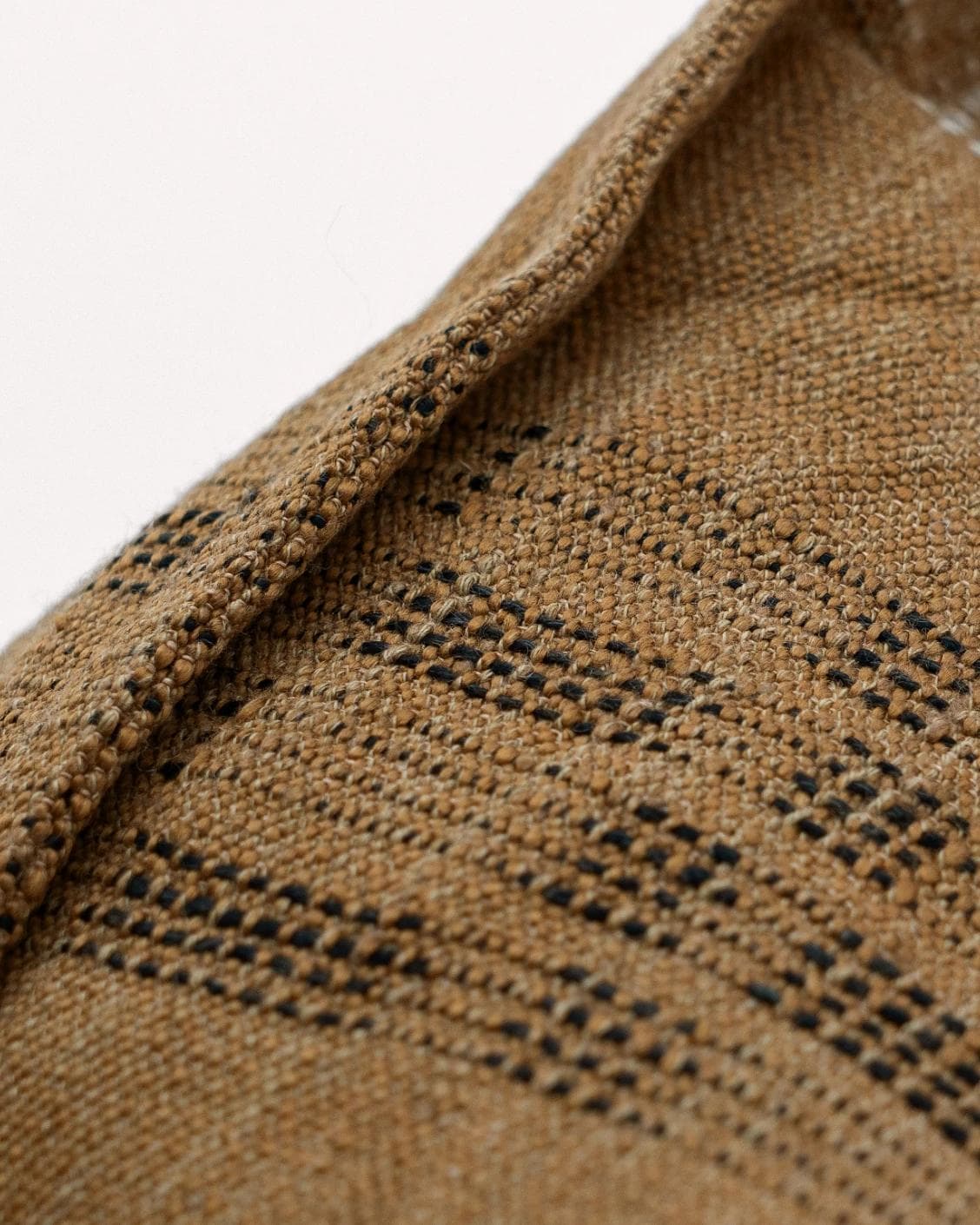 Yon Ochre cushion in ochre brown, shown in a product close-up as image 7