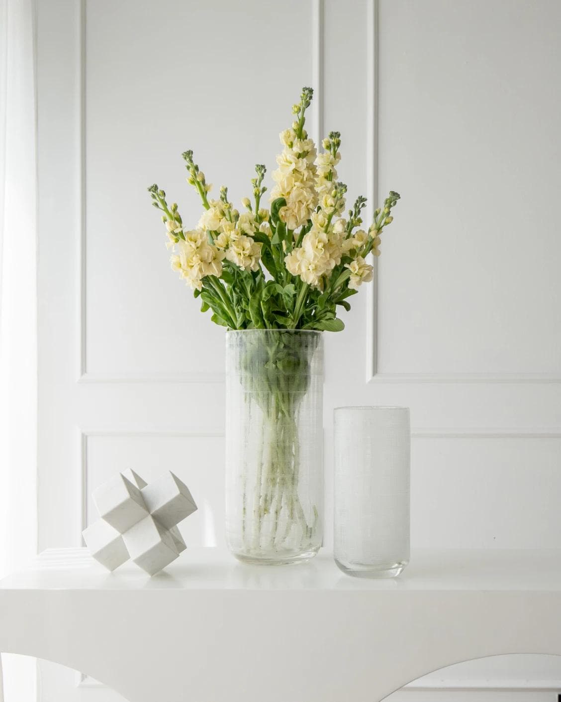 Zaha Bundle vases in white and translucent, shown in a lifestyle front view as image 2