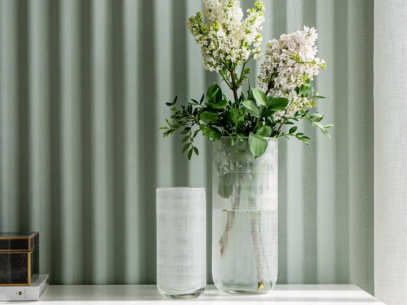Zaha Bundle vases in white and translucent, shown in a lifestyle front view as image 4