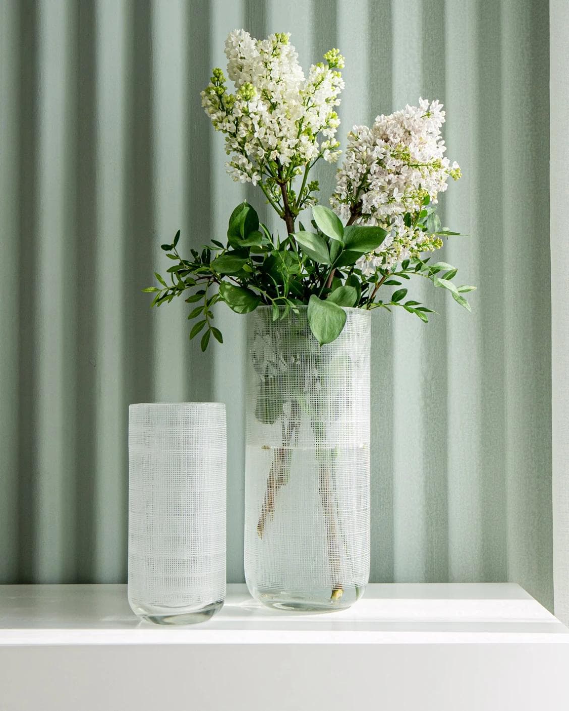 Zaha Bundle vases in white and translucent, shown in a lifestyle front view as image 5