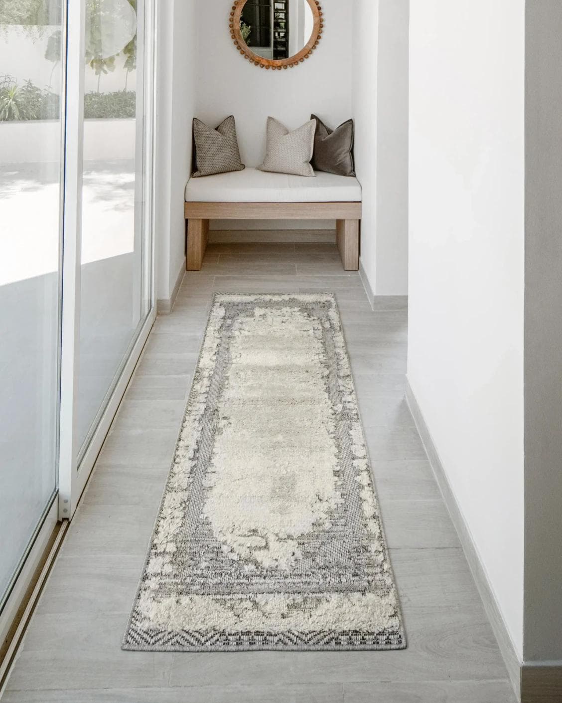 Zahra Bianca Runners carpet in grey and ivory, shown in a lifestyle front view