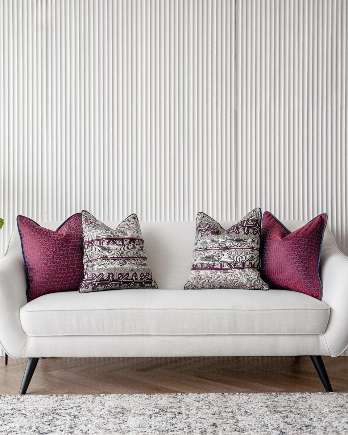 Zain Bundle cushion in black, silver and purple, shown in a lifestyle front view as image 4