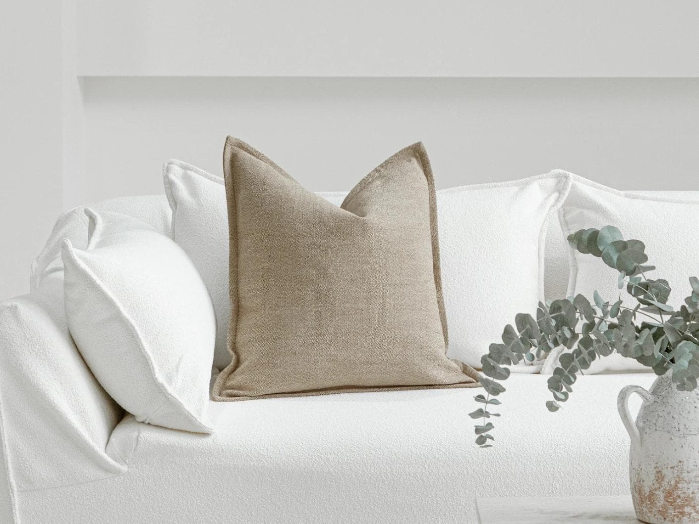 Zane Braun cushion in beige, shown in a lifestyle front view as image 4