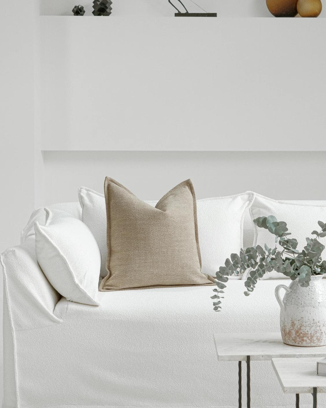 Zane Braun cushion in beige, shown in a lifestyle front view as image 4