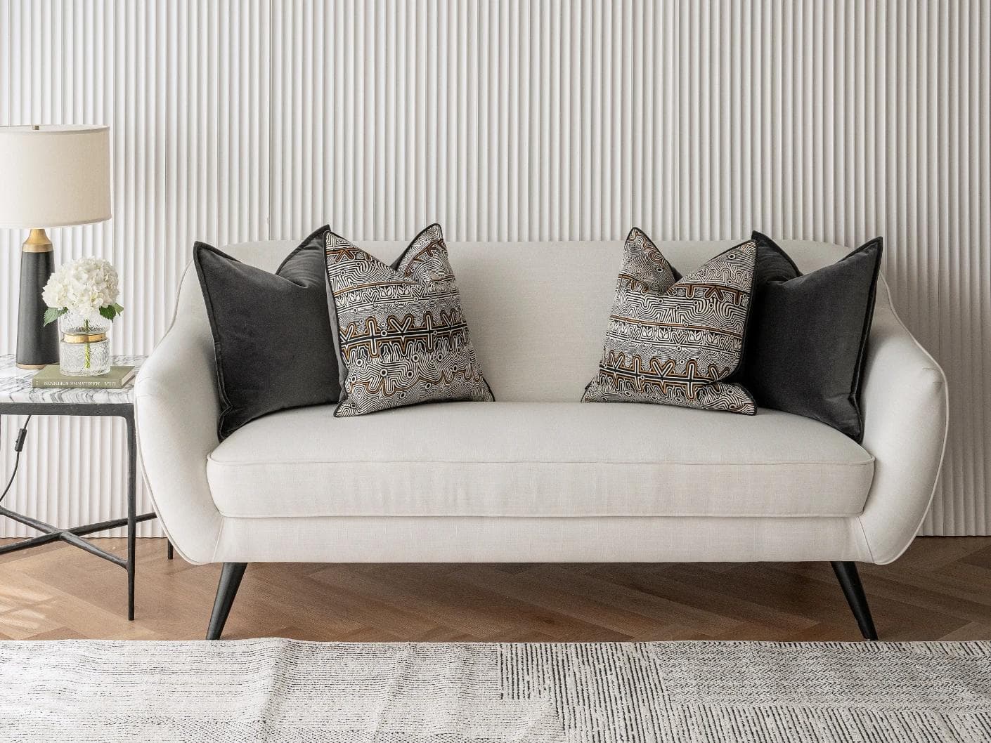 Zayn Bundle cushion in black, grey and silver, shown in a lifestyle front view as image 4