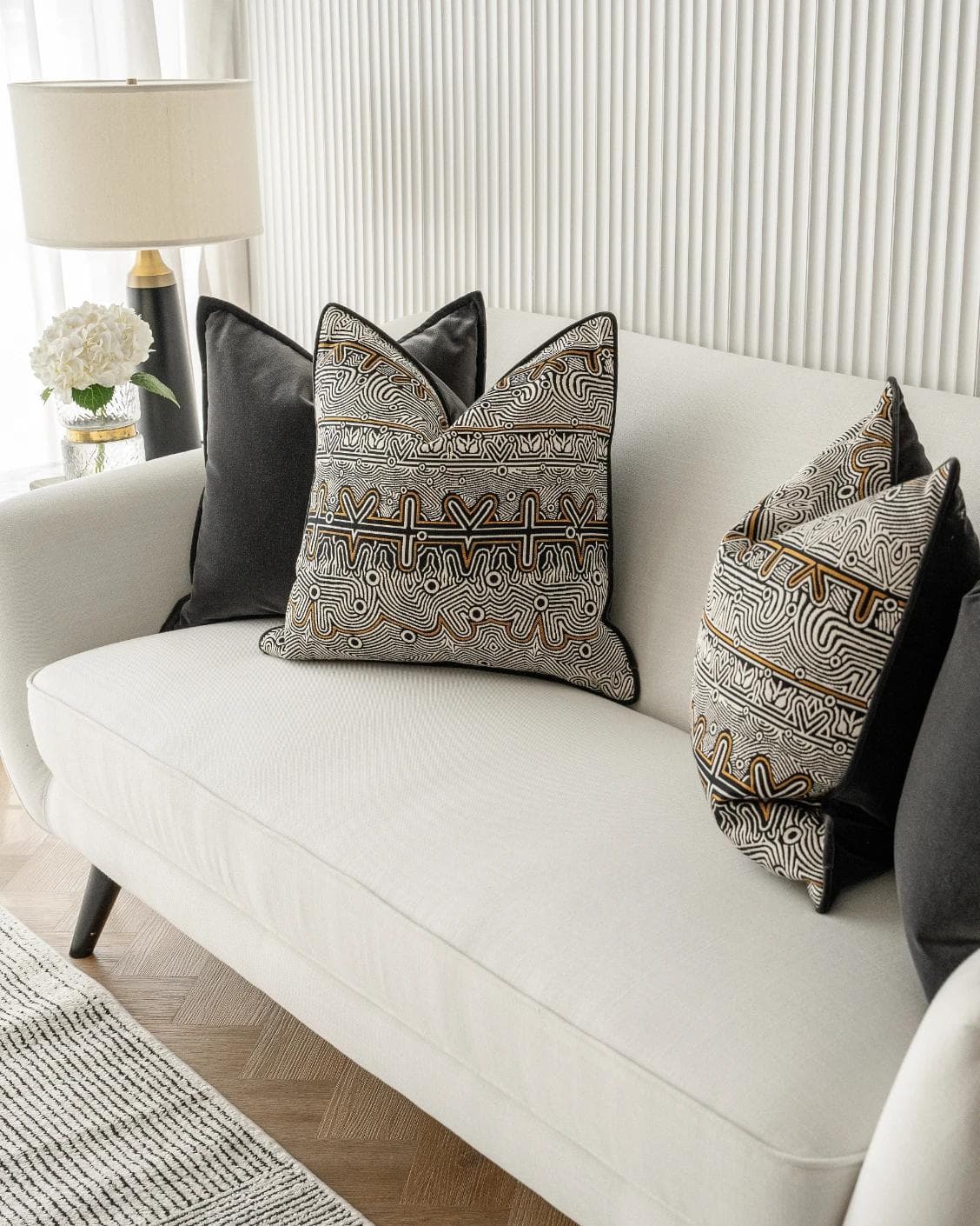 Zayn Bundle cushion in black, grey and silver, shown in a lifestyle right view as image 5