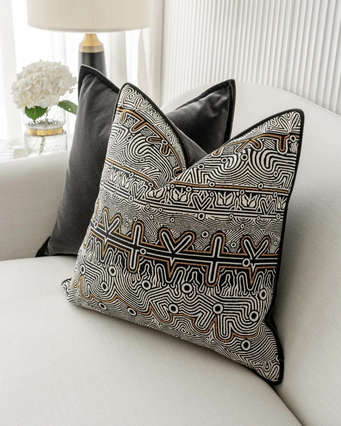 Zayn Bundle cushion in black, grey and silver, shown in a lifestyle right view as image 6