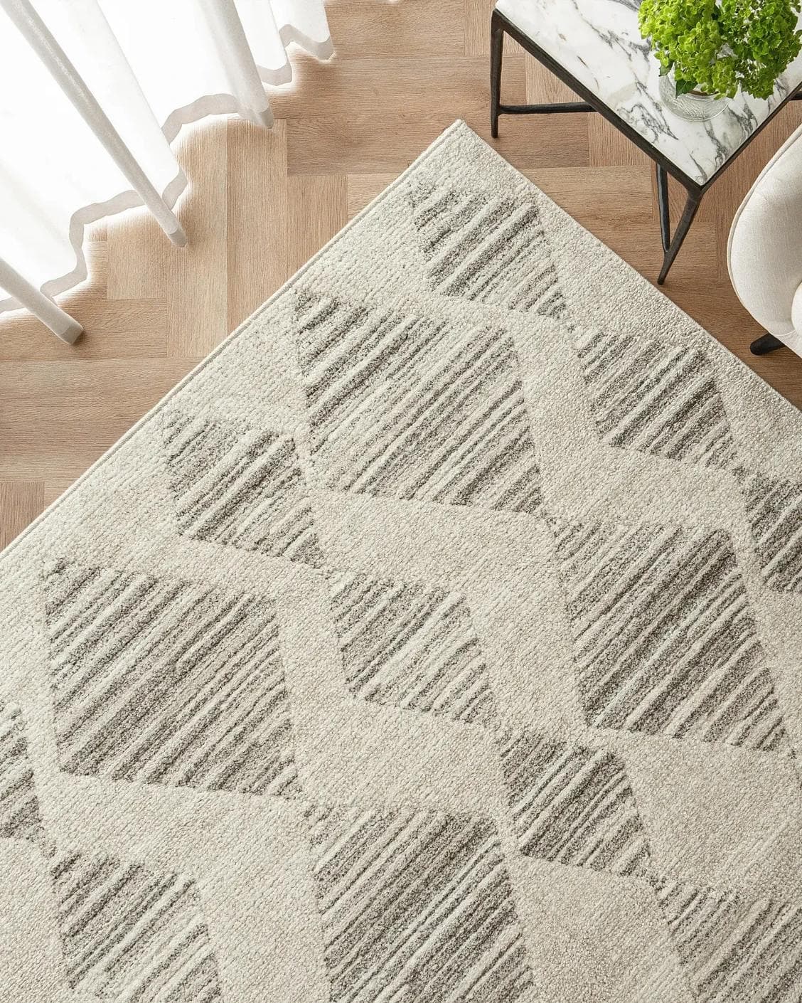 Zen Alba carpet in cream, beige and grey, shown in a lifestyle top view as image 2