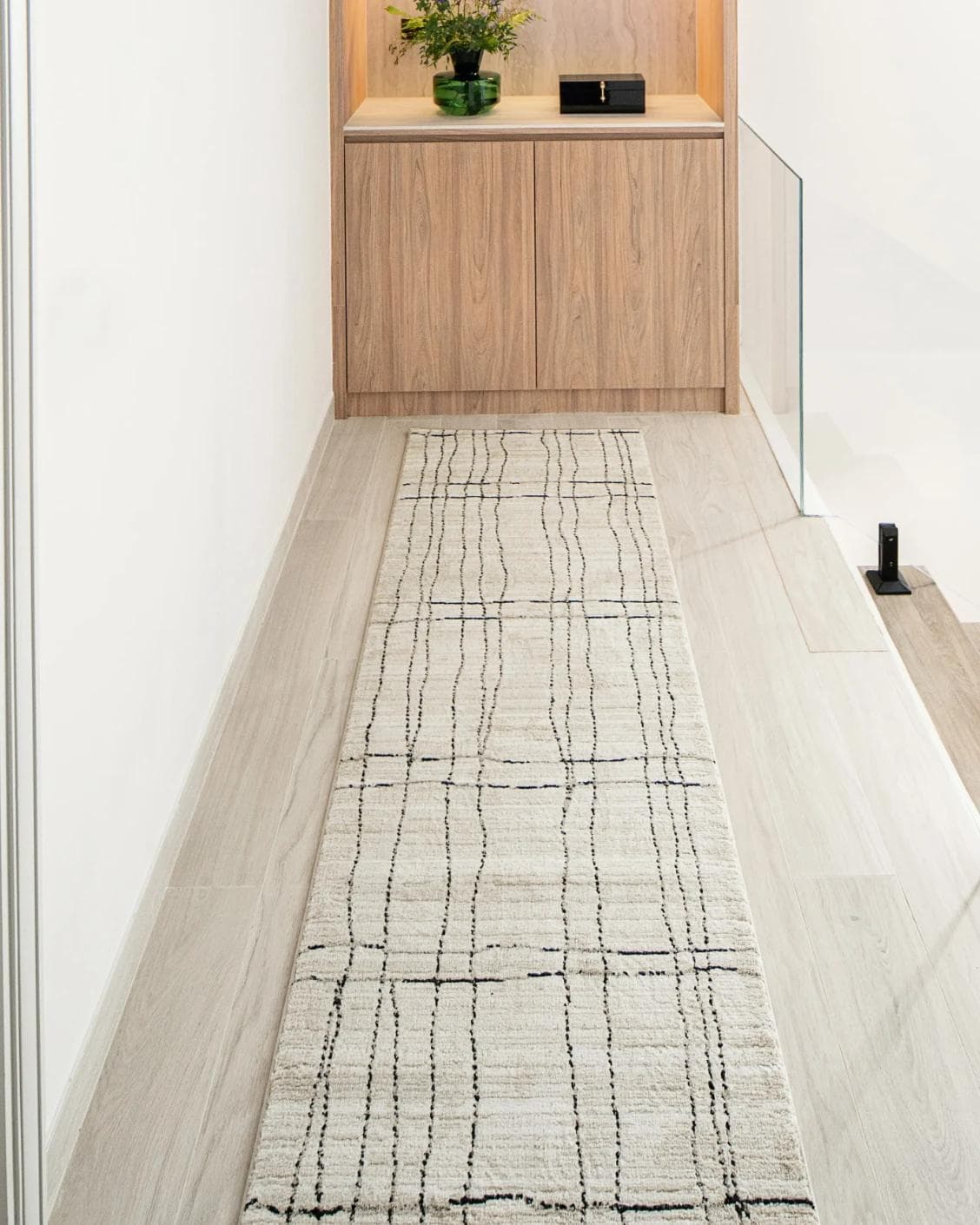 Zen Bianca Runners carpet in charcoal and beige, shown in a lifestyle front view