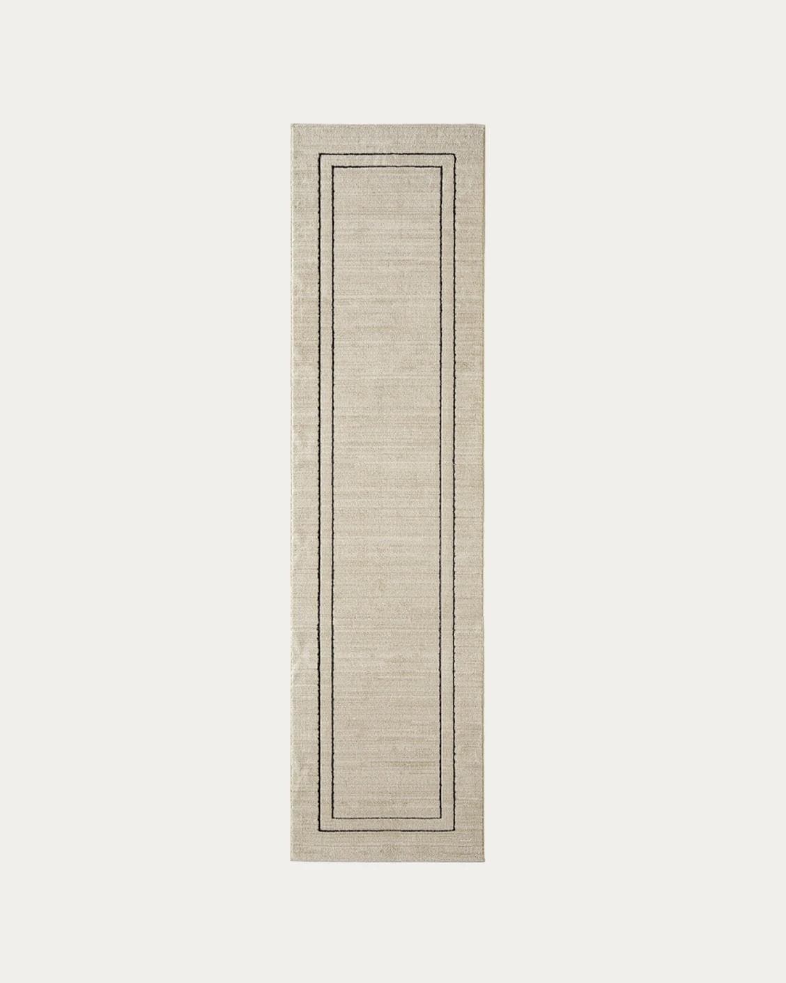 Zen Colin carpets in black and beige, shown in a product top view as image 1