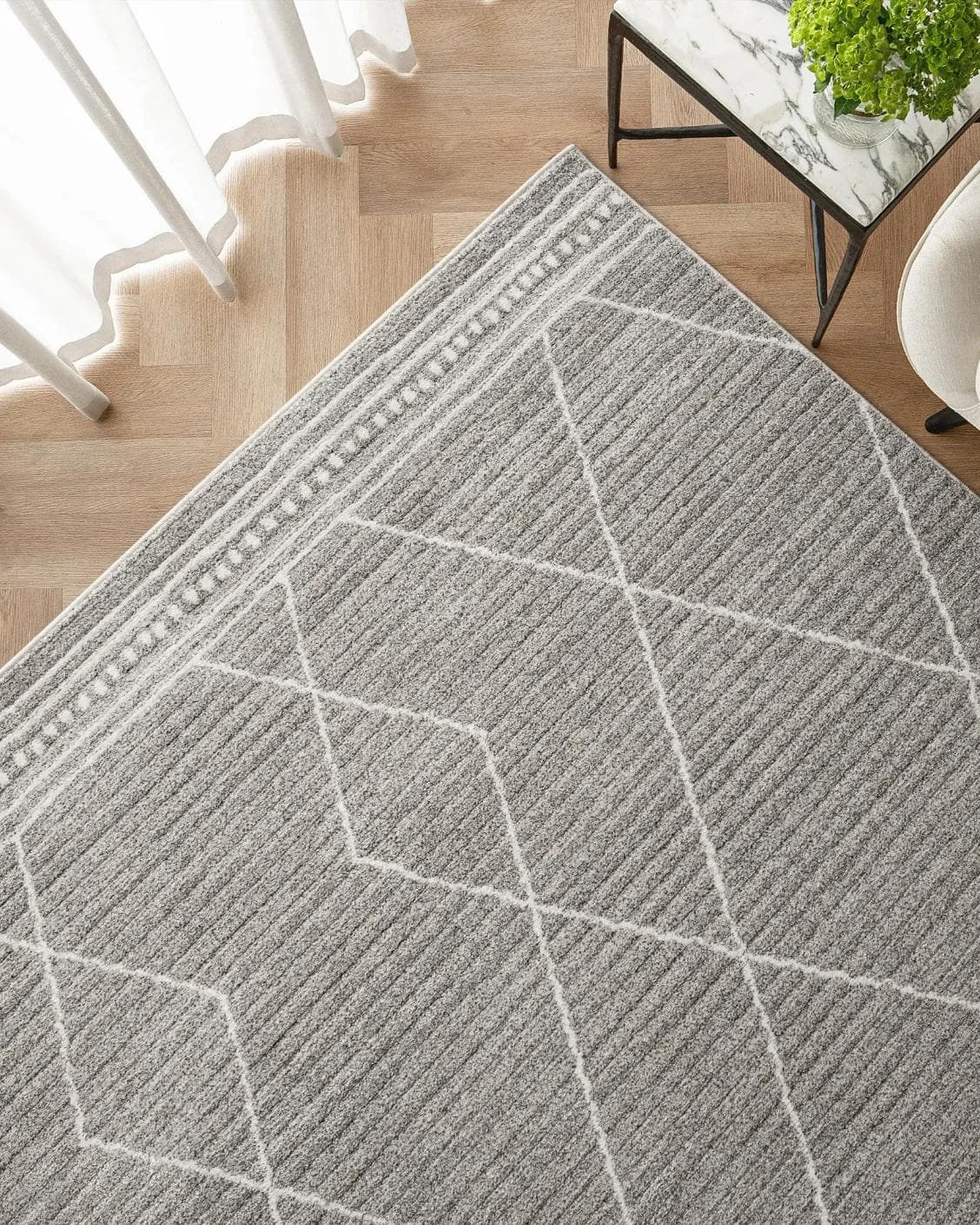 Zen Dune carpet in grey and off white, shown in a lifestyle top view as image 2