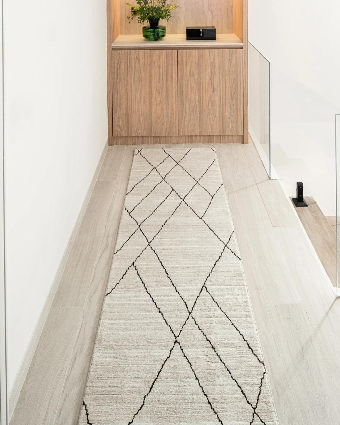 Zen Pearl Runners carpet in charcoal and ivory, shown in a lifestyle front view