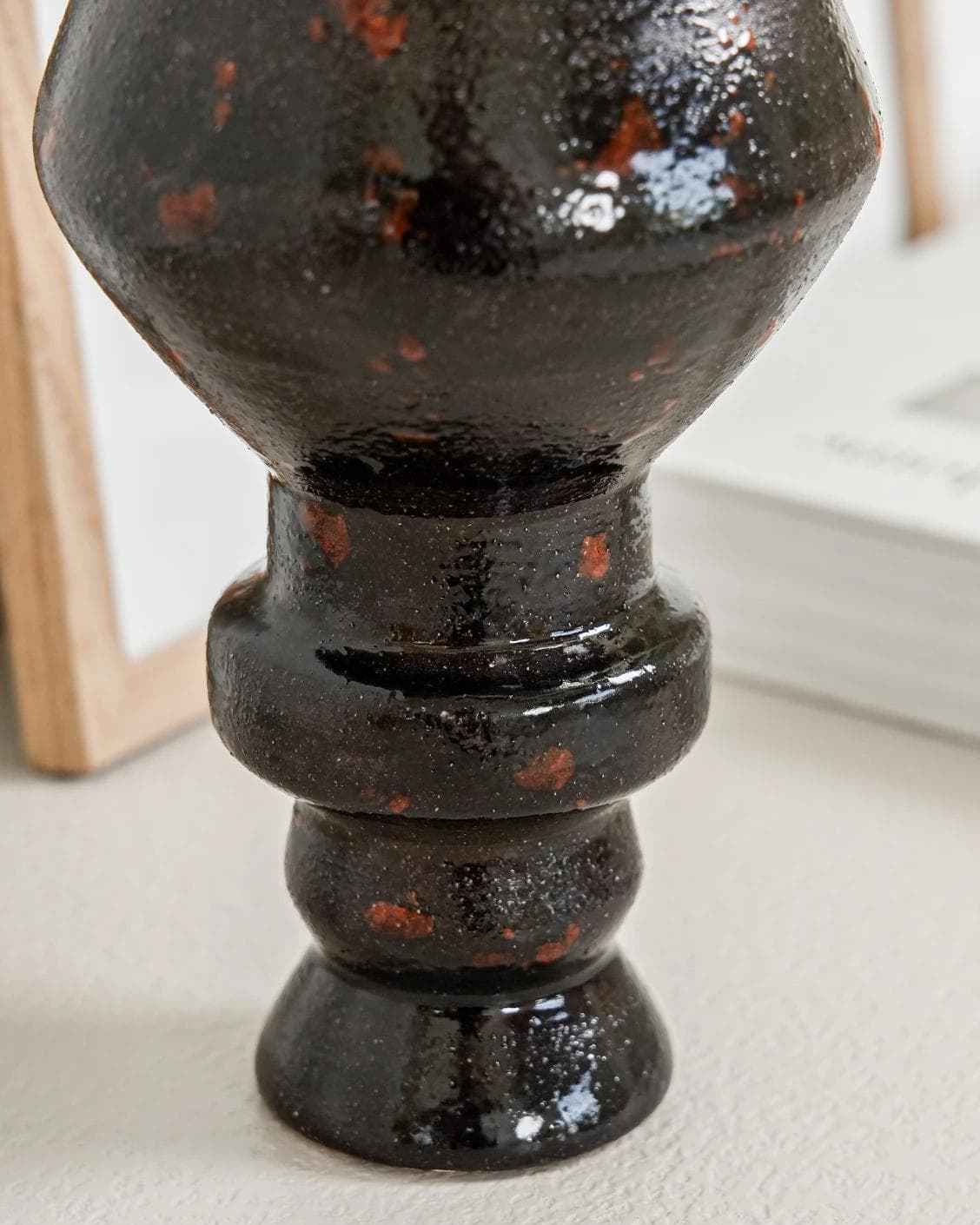 Zenith Terra I statues and sculptures in charcoal black and black, shown in a lifestyle close-up as image 4