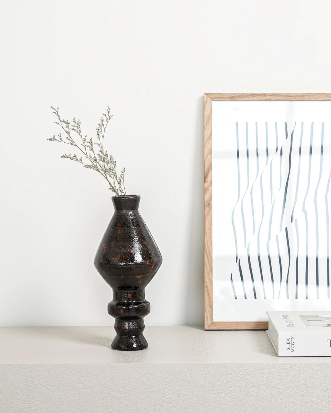 Zenith Terra I statues and sculptures in charcoal black and black, shown in a lifestyle front view as image 6