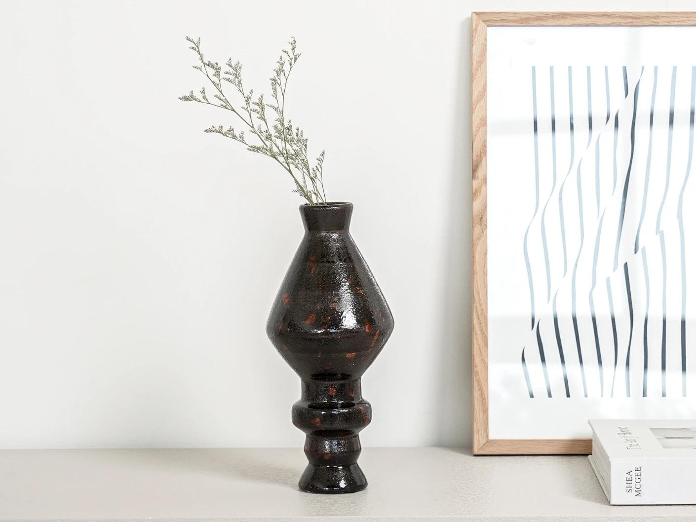 Zenith Terra I statues and sculptures in charcoal black and black, shown in a lifestyle front view as image 6