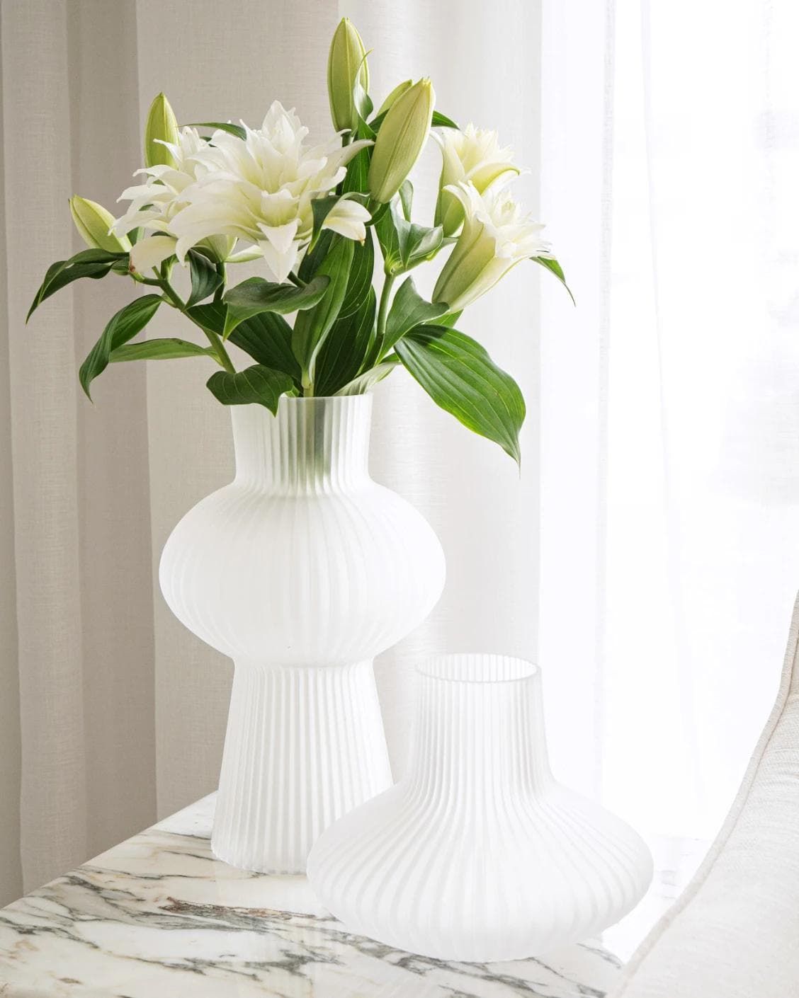 Zenya Bundle vases in white, shown in a lifestyle front view as image 2