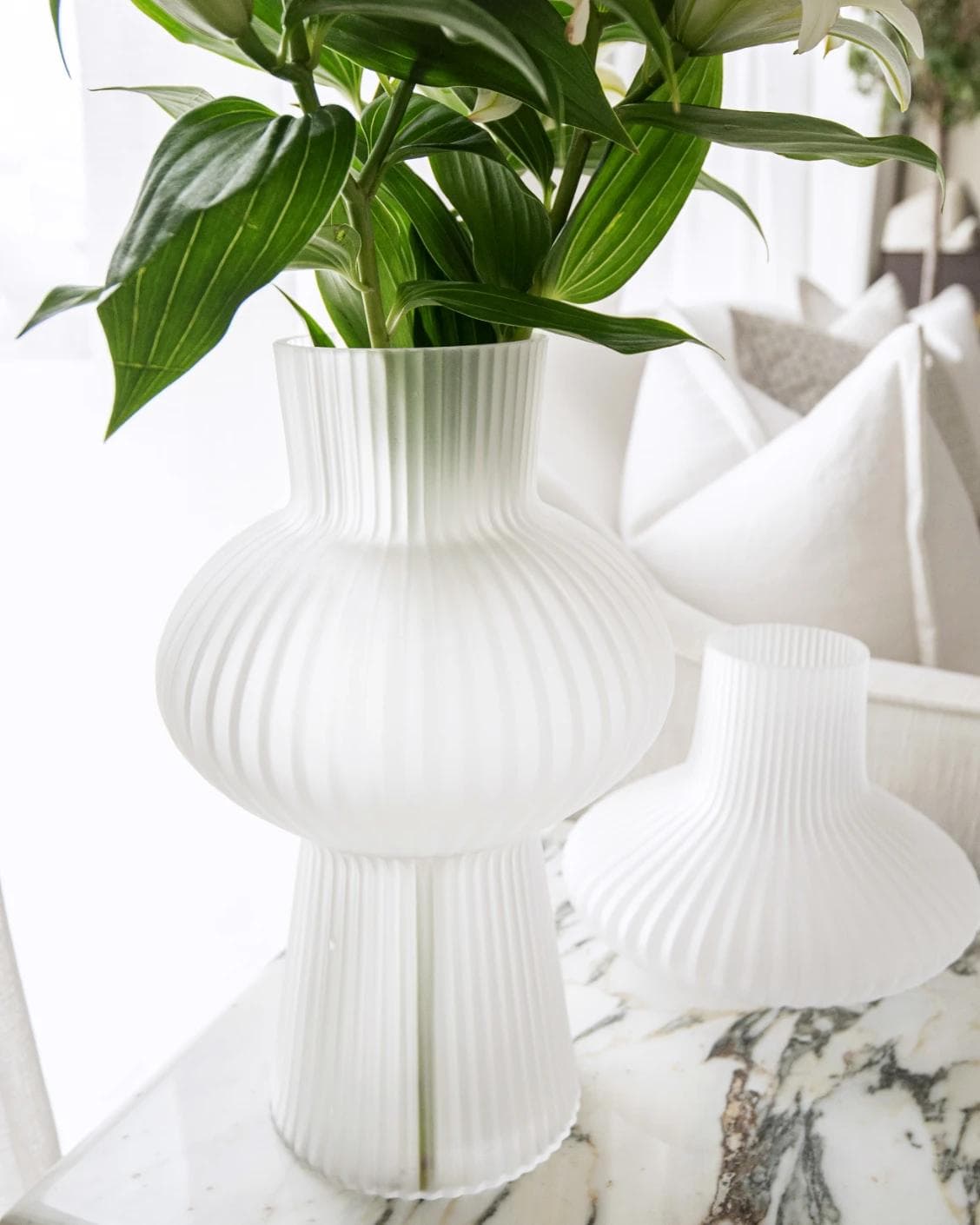 Zenya Bundle vases in white, shown in a lifestyle left view as image 7