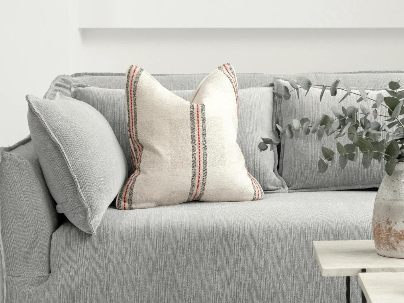 Zia Hodler cushion in multicolour and ivory, shown in a lifestyle front view as image 4