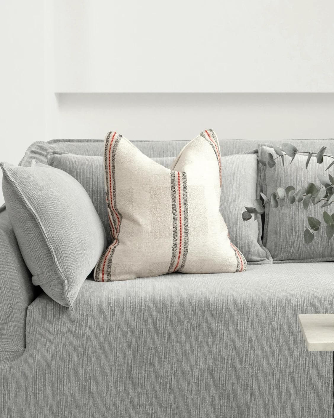 Zia Hodler cushion in multicolour and ivory, shown in a lifestyle front view as image 4