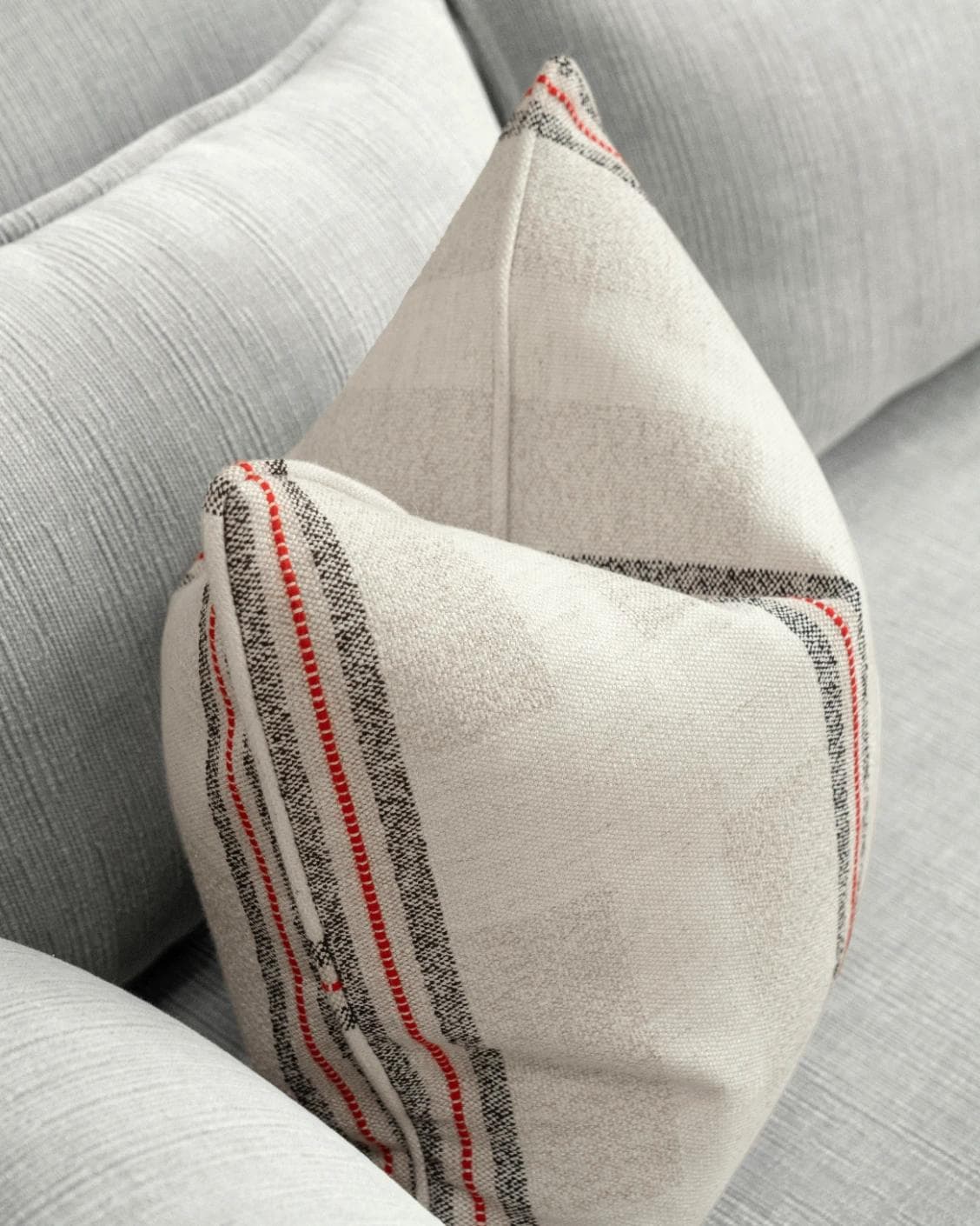 Zia Hodler cushion in multicolour and ivory, shown in a lifestyle top view as image 5