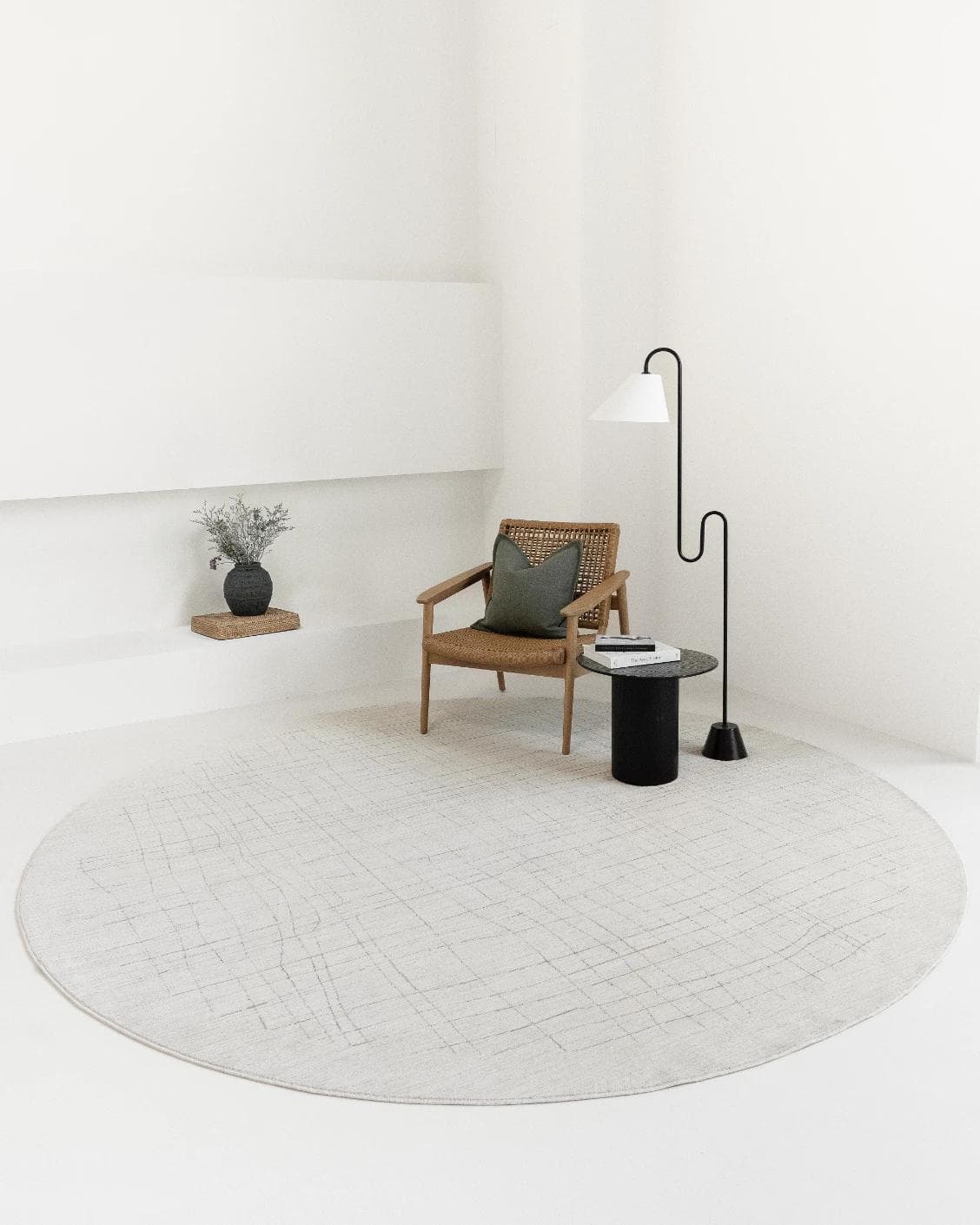 Zion Sandy Round carpet in ivory, shown in a lifestyle front view