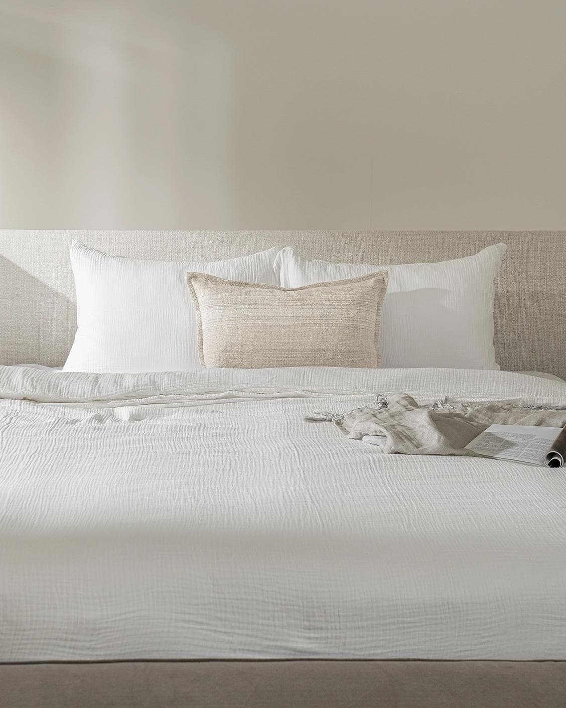 Zoe Laurent III cushion in beige, shown in a lifestyle front view as image 2