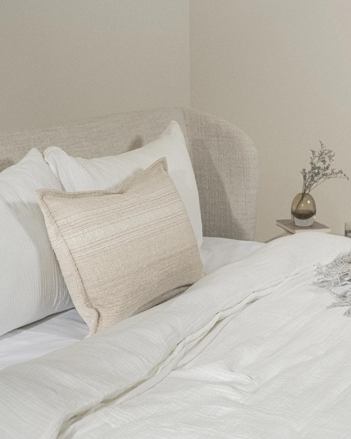 Zoe Laurent III cushion in beige, shown in a lifestyle left view as image 4