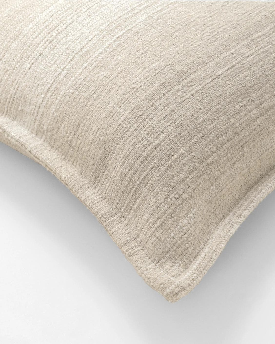 Zoe Laurent III cushion in beige, shown in a product close-up top view as image 6