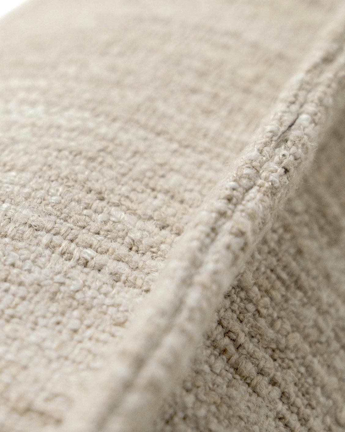 Zoe Laurent III cushion in beige, shown in a product close-up top view as image 8