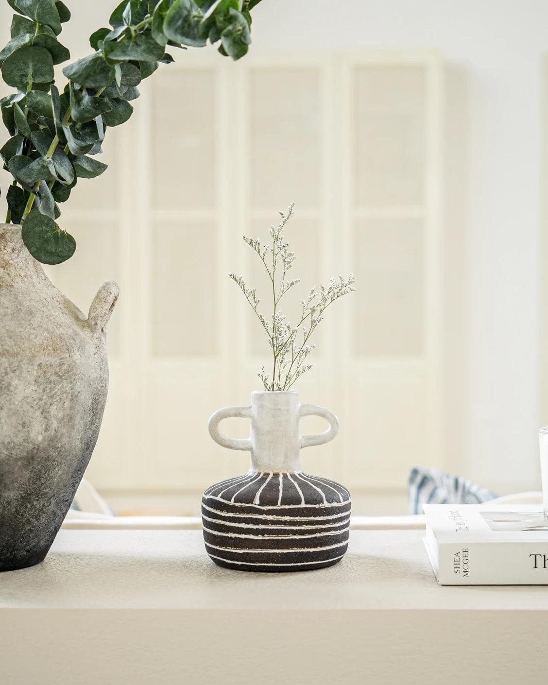 Zyra Terra vases in charcoal black, charcoal and white, shown in a lifestyle front view as image 5